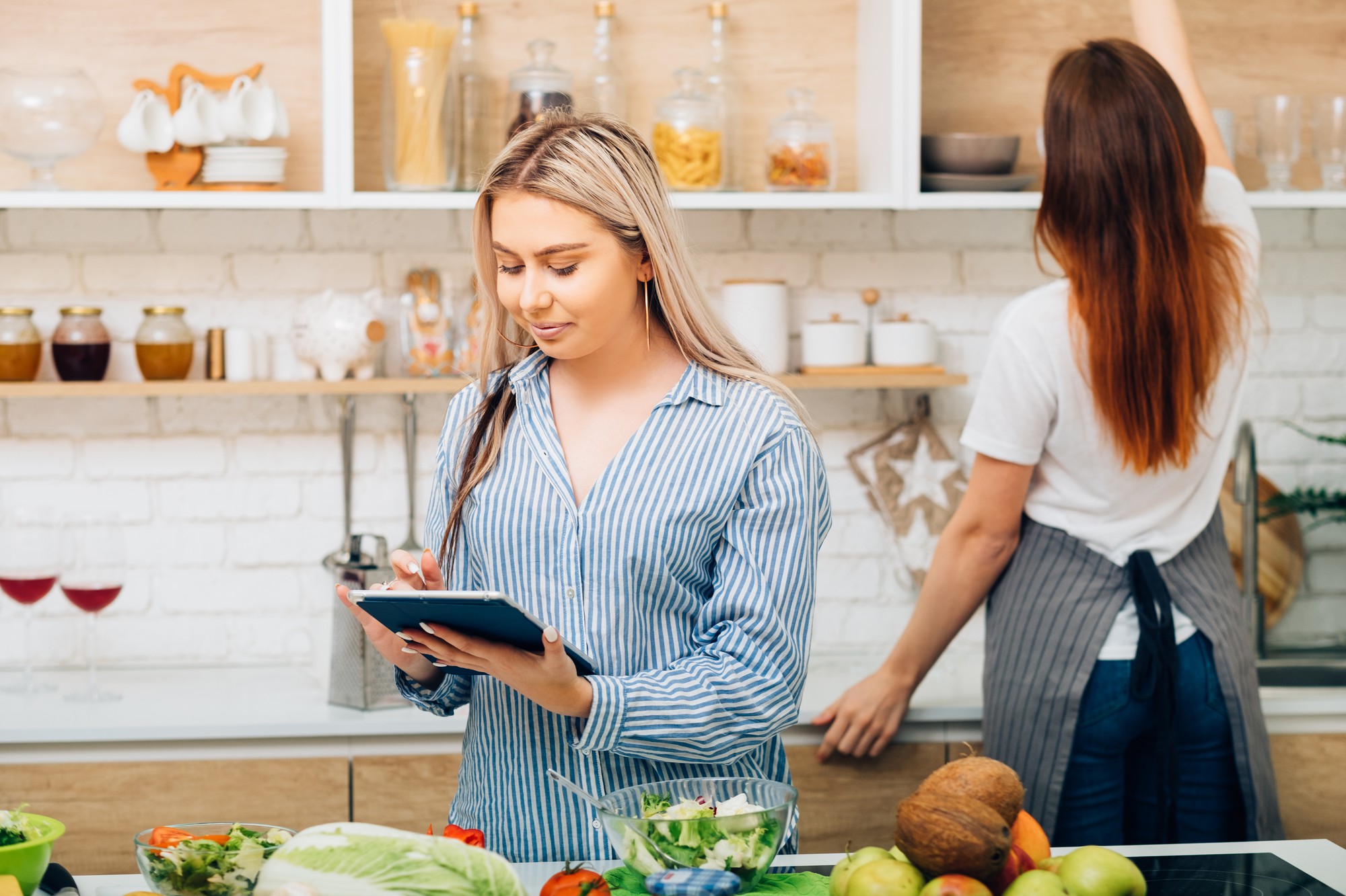 Team member preparing quick meal using tablet app